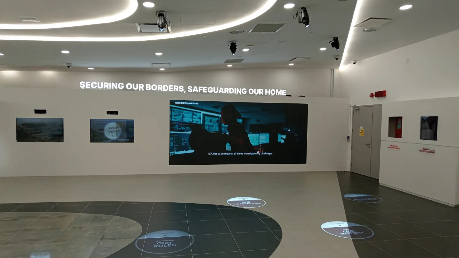Projected floor prompts at the ICA Services Centre